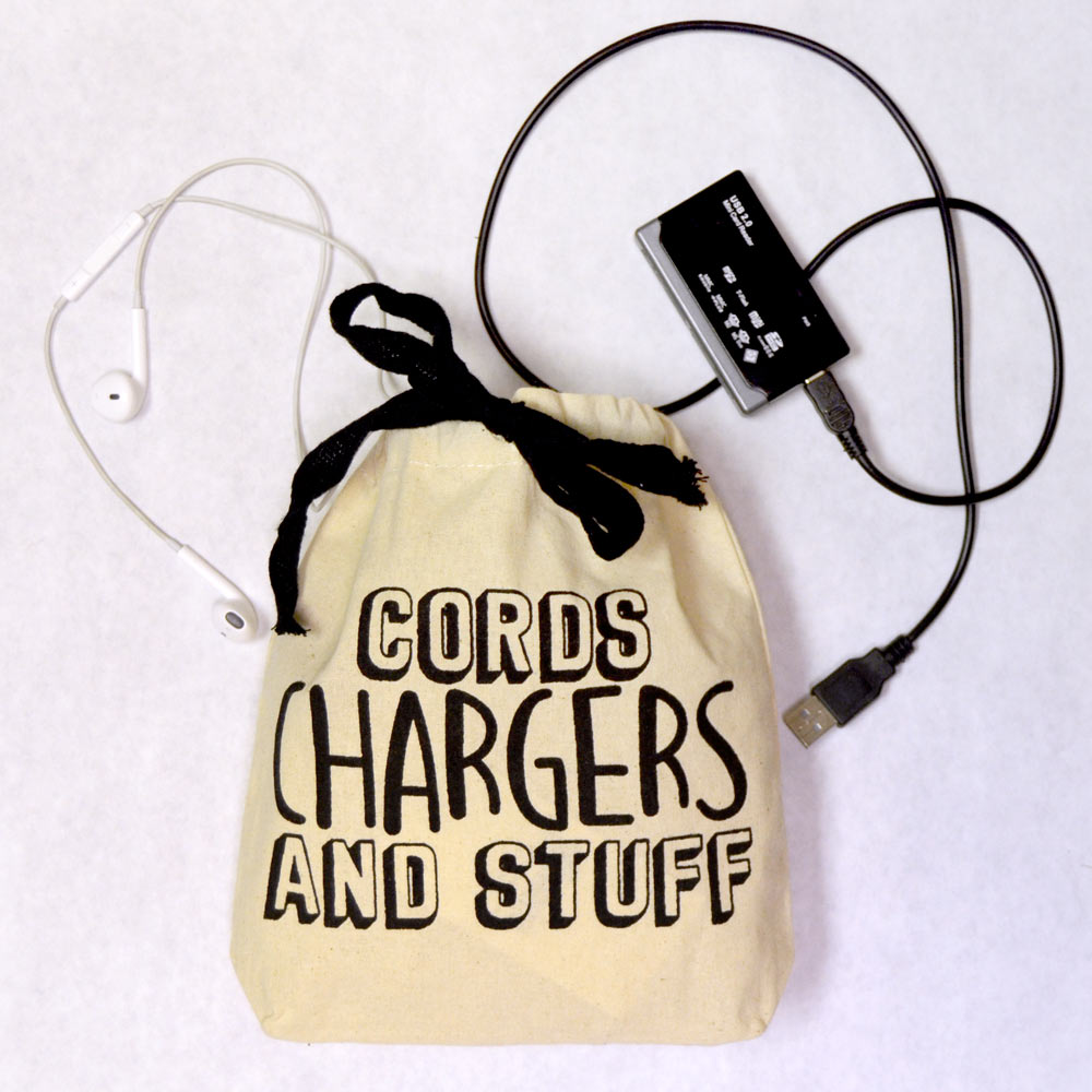 canvas bag with cords, chargers and stuff block
