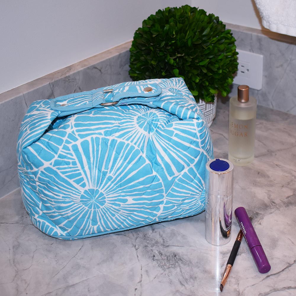 full circle turquoise quilted cosmetic with handle