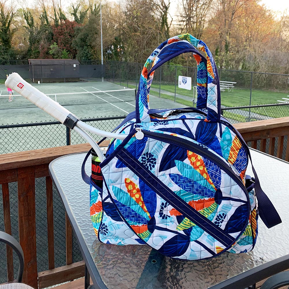lei'd back quilted tennis tote